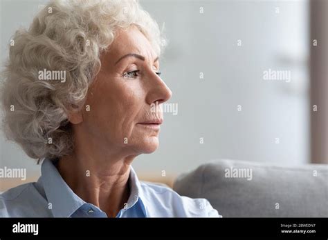 Pensive serious old woman face profile closeup view Stock Photo - Alamy