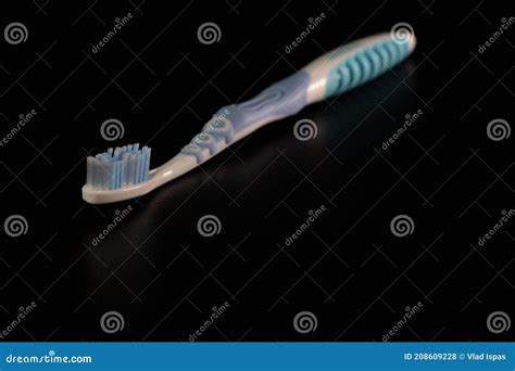 Selective Focus On Toothbrush Isolated On Black Background Stock Photo