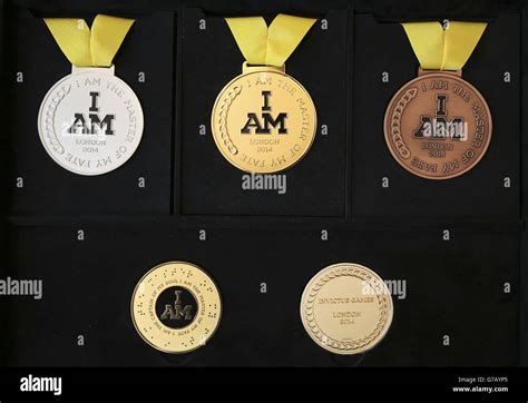 Invictus Games medal unveiling. The Invictus Games medals (top) and ...