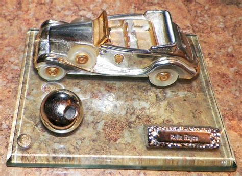 Any Info On Silver Vintage Rolls Royce On Glass Base Desk Top Pen