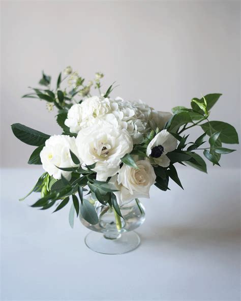 Classic, organic green and white reception centrepiece arrangement with ...