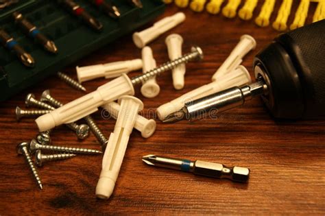 Fitter S Place Of Work Gun And White Plastic Dowels Stock Image