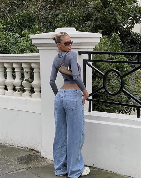 spring outfit inspo / simple outfit inspo / 90s jeans / low waisted jeans / slick bun / clean ...