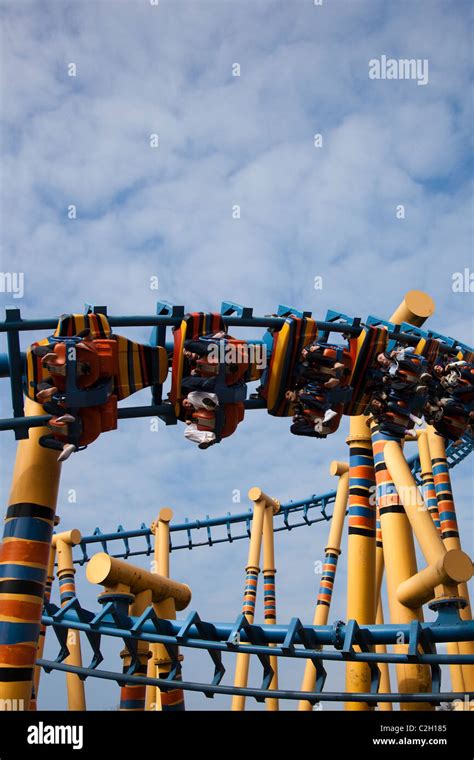 Riders Enjoying Exhilarating Roller Coaster White Knuckle Fairground