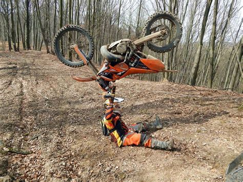 Dirt bike rider holding up his dirtbike after failed wheelie (x-post ...