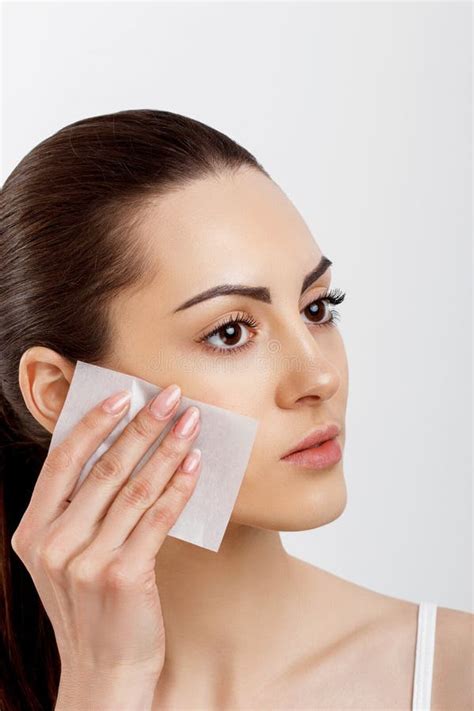 Skin Care Young Woman Removing Oil From Face Using Blotting Papers