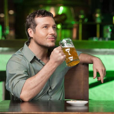 Tasting A Good Beer Portrait Of Thoughtful Men Drinking Beer At Stock Image Image Of Holding