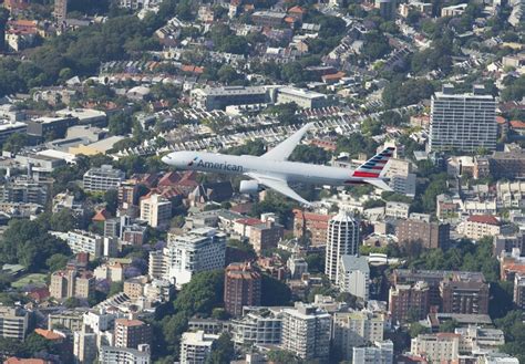 American Airlines 777 300er Flies Over Sydney Harbour Ahead Of Welcome Into Qantas Hangar 96