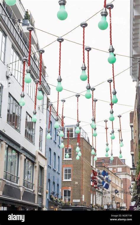 Green light bulbs decorate a shopping street in london hi-res stock ...