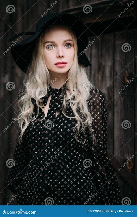 Beautiful Attractive And Stylish Girl Wearing Black Hat Standing Posing In City Nude Makeup