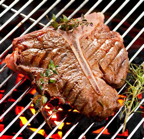 Beef T Bone Steaks On The Grill With Flames Stock Image Image Of