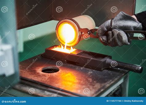 Melting Gold Molted Metal Pouring Into Bar Form Stock Photo Image Of