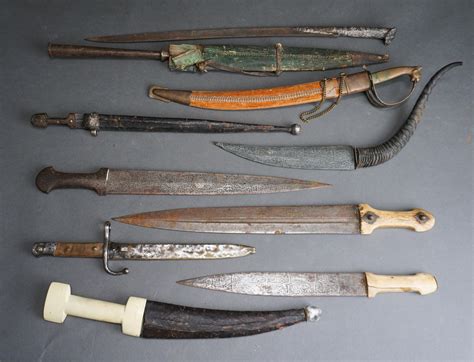 Lot Nine Middle Eastern And North African Short Swords Predominantly