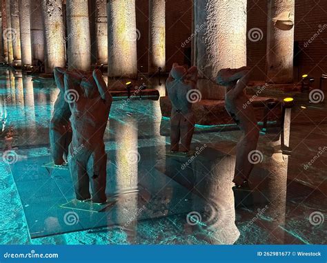 Statues Of Four Men And Columns In The Water In The Restored Basilica