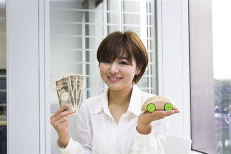 Happy Young Woman Holding Japanese Yen And Toy Car Stock Image Image
