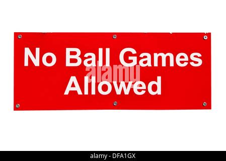 No Ball Games Sign Against A Brick Wall In A Residential Area To