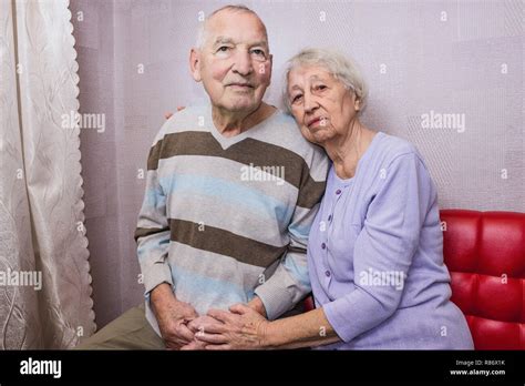 Happy Affectionate Mature Old Man And Woman Embracing Looking At Camera Stock Photo Alamy