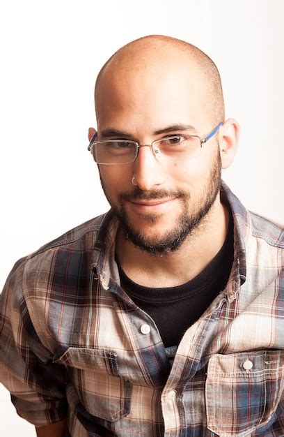 Premium Photo Portrait Of Smiling Man Wearing Eyeglasses Against