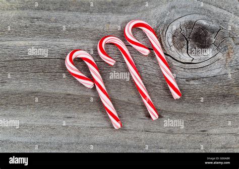 Candy Canes On Rustic Wood Stock Photo Alamy