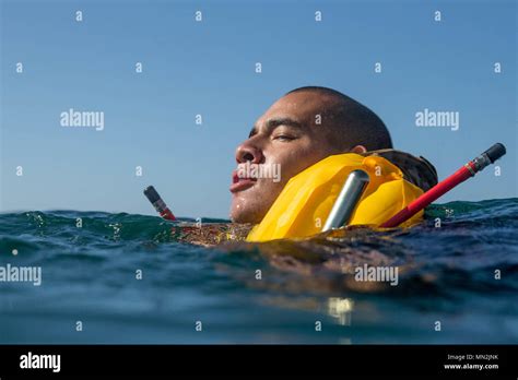 A U S Marine With Rd Assault Amphibian Battalion Swims With A Life