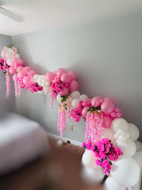 Pink And White Balloon Garland With Pink Flowers In 2024 Balloon