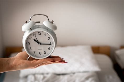 Premium Photo Photo Of Women S Hand Holding Alarm Clock