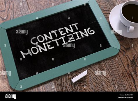 Content Monetizing Handwritten By White Chalk On A Blackboard Stock