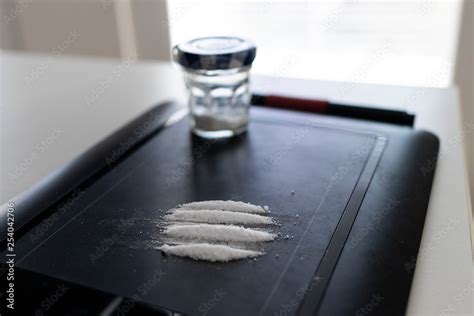 Designer drugs, cocaine lines on the tablet of a graphic designer Stock ...