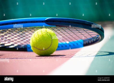 Tennis Racquet And Ball Lying On The Court Healthy Lifestyle Concept