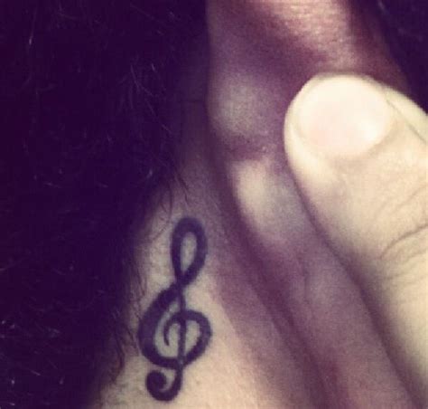 Treble Clef Behind The Ear Tattoo