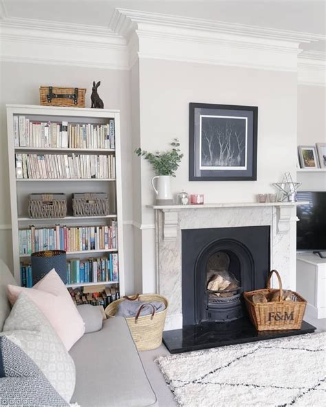 Farrow and Ball Ammonite living room walls in period property. Traditional cast iron fireplace ...