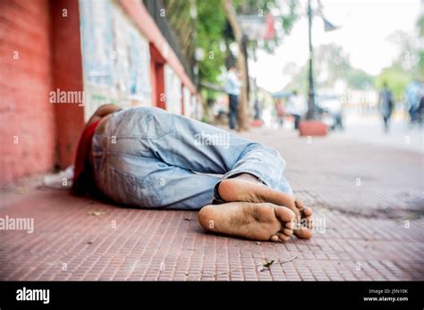 A Homeless Man Sleeping On The Streets Of Delhi India Stock Photo Alamy