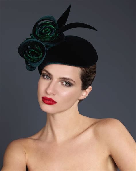 A Woman Wearing A Black Hat With Green Flowers On It S Head And Red Lipstick