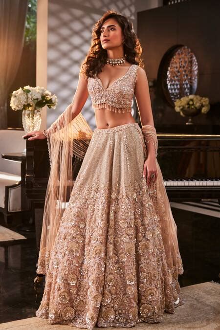 Buy Peach Organza Hand Embroidered Floral Plunged Sparkle Lehenga Set