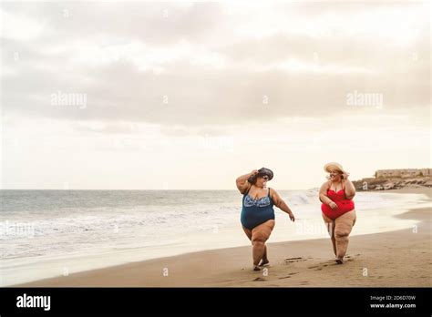 Happy Plus Size Women Having Fun Walking On The Beach Curvy Confident People Lifestyle Concept