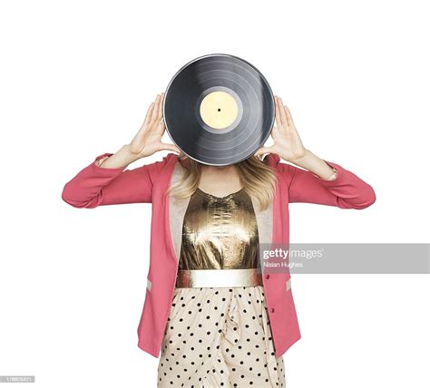 Young Woman Holding Record In Front Of Face High Res Stock Photo