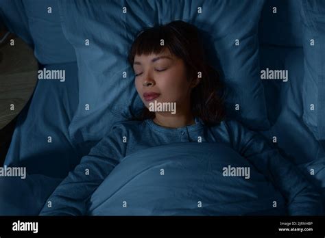 Asian Woman Sleeping In Bed At Home At Night Stock Photo Alamy