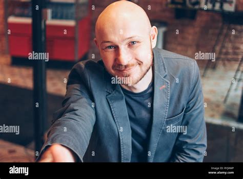 Smiling Attractive Adult Successful Bald Bearded Man In Suit With