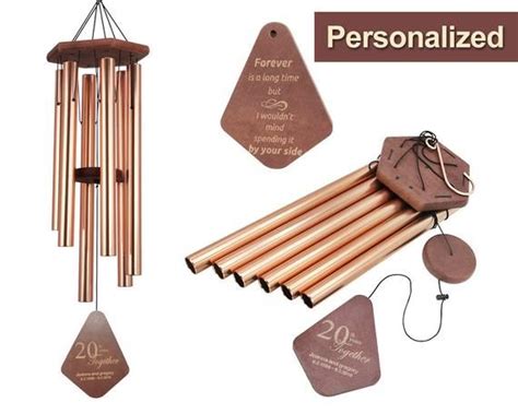 A Wooden Wind Chime With Personalized Tags On The Front And Back Along