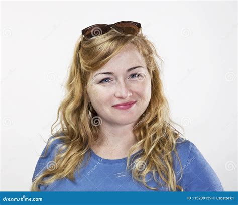 Smiling Positive Blonde Female With Blue Shirt And Attractive Look