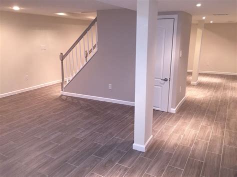 Basement Finished Basement Finishing Ideas With Laminate Wood Flooring Around Cream Painted