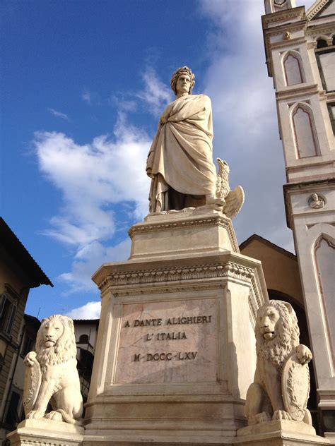 A Statue Is Shown In Front Of A Tall Building