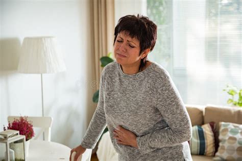 Mature Woman Suffering From Stomach Ache Stock Image Image Of Grab