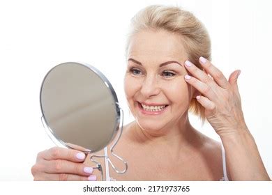 Mature Halfnaked Woman Smiling While Showing Stock Photo