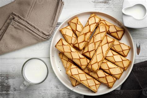 Sfogliatine An Italian Puff Pastry With Glaze On A Plate On White