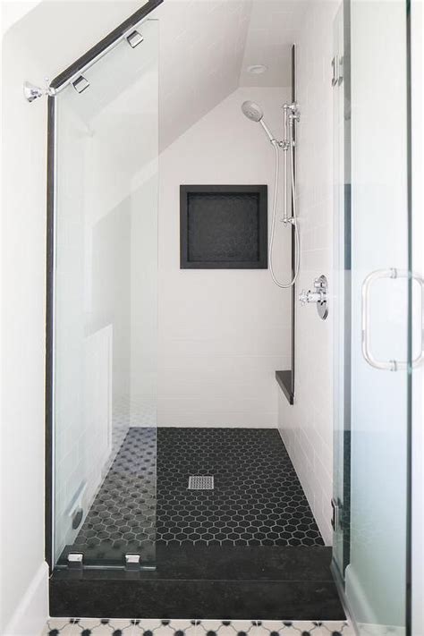 Chic Black And White Walk In Shower Boasts Black Hex Floor Tiles Lined