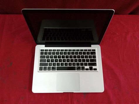 Apple MacBook Pro A1278 w/ Cable - Sierra Auction Management Inc