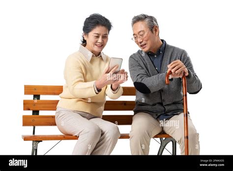 Couple Assis Sur Un Banc Bavardant Banque De Photographies Et Dimages