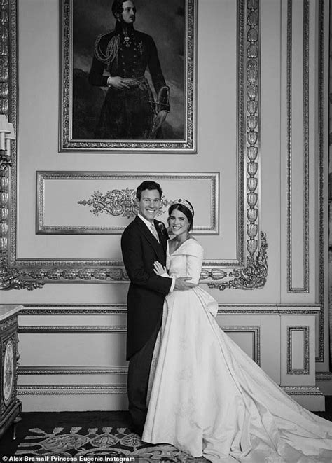 Princess Eugenie and Jack Brooksbank are pictured embracing in front of a portrait of Prince ...