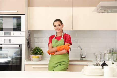 Beautiful Young Woman Wearing Gloves And Apron In Clean Kitchen Stock Image Image Of Dining